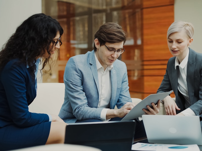 Corporate finance team reviewing business payroll